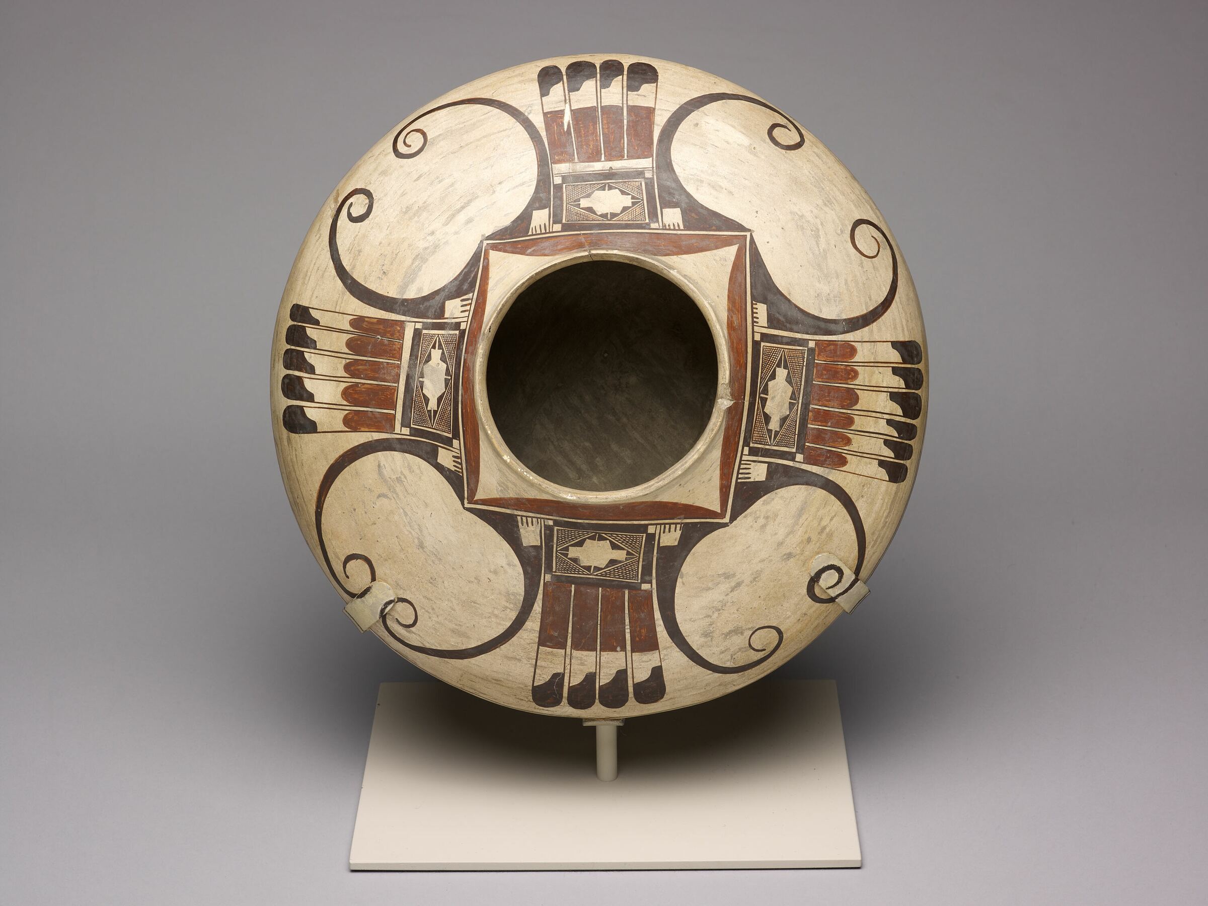 Seed jar with Sikyátki motifs, painted in black and red on a cream slip